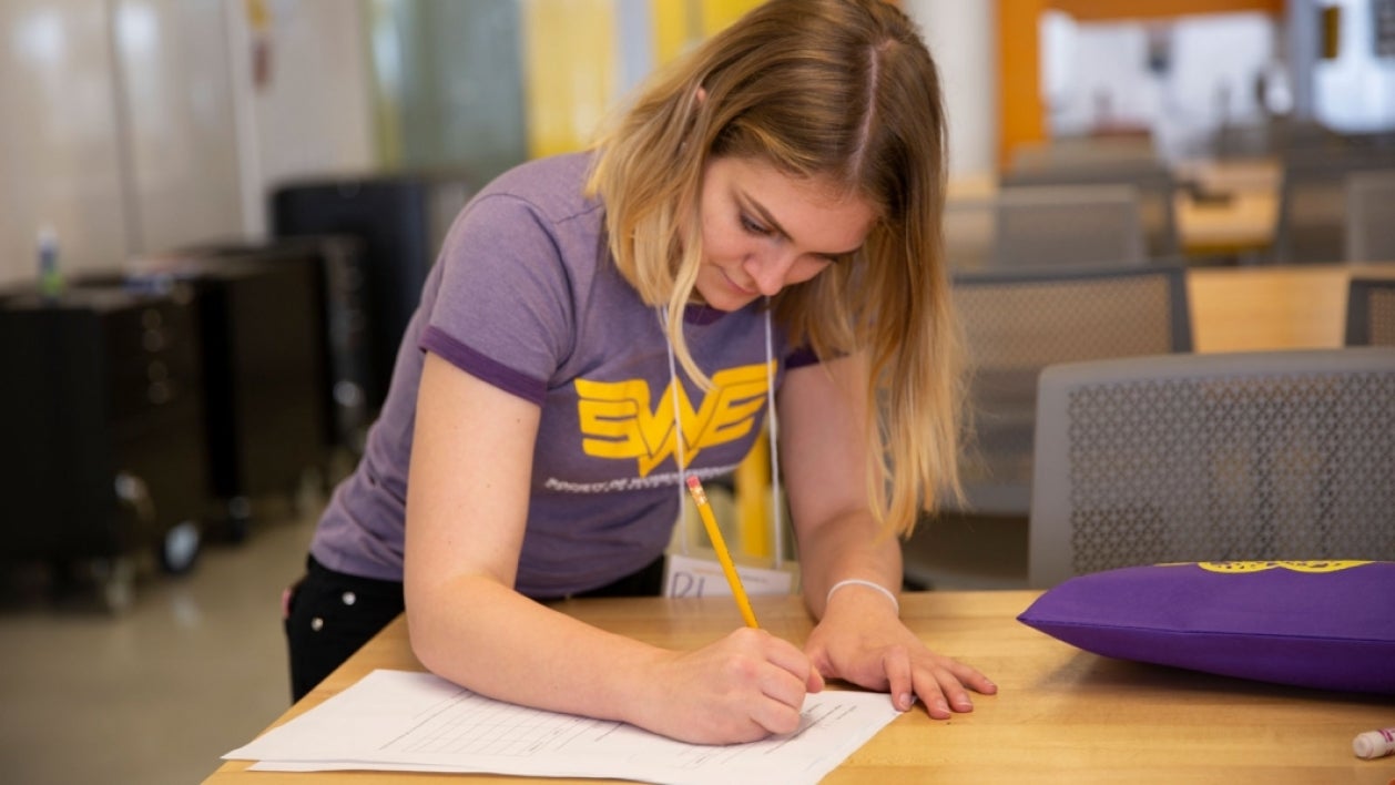 Aerospace engineering major and Society of Women Engineers Co-director of outreach Rhiannon Lewis works on a project for the organization’s 2019 GEAR Day outreach event.