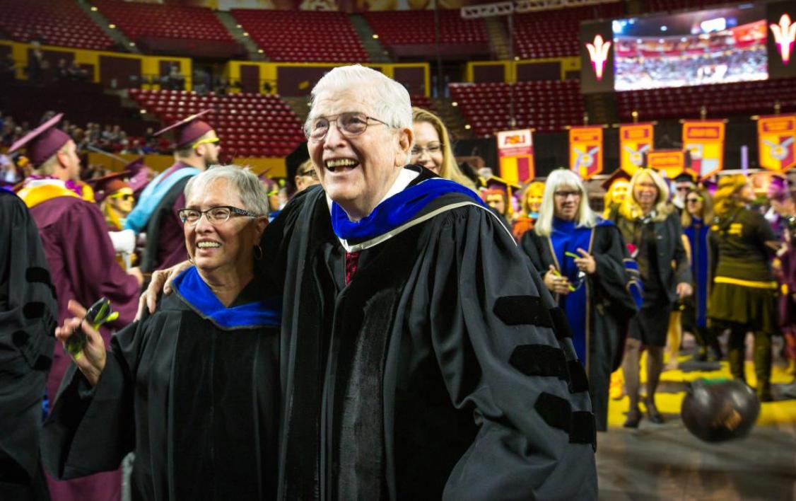 two people hugging at commencement