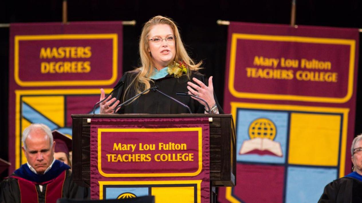 woman speaking at a podium