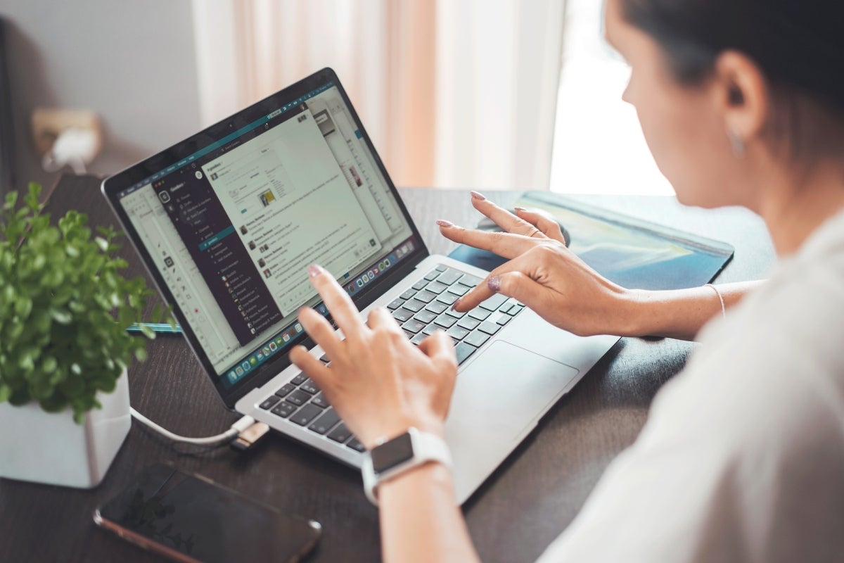 person typing on laptop