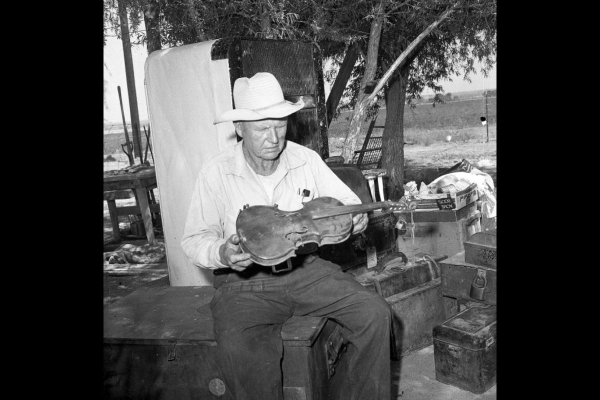 man holding violin