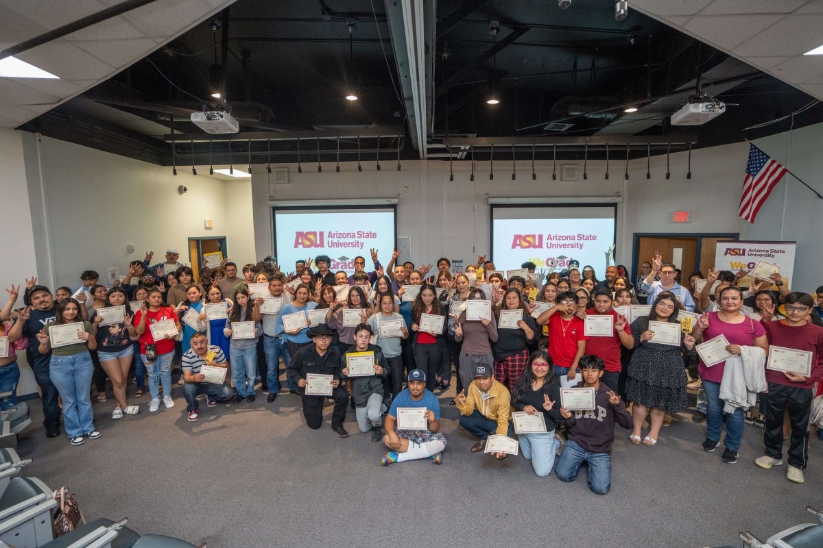 Group photo of high school students at a program graduation ceremony.