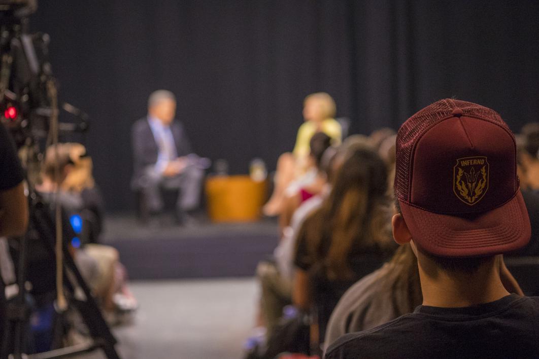 A student sits in an audience