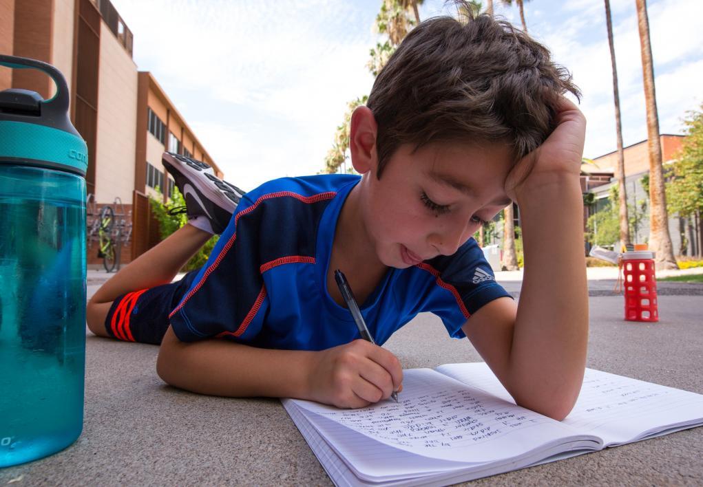 Young Adult Writing Program campers practice creative writing.