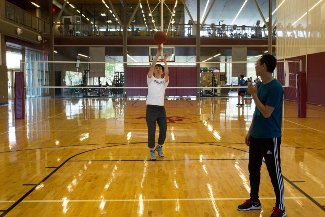 Men playing basketball.