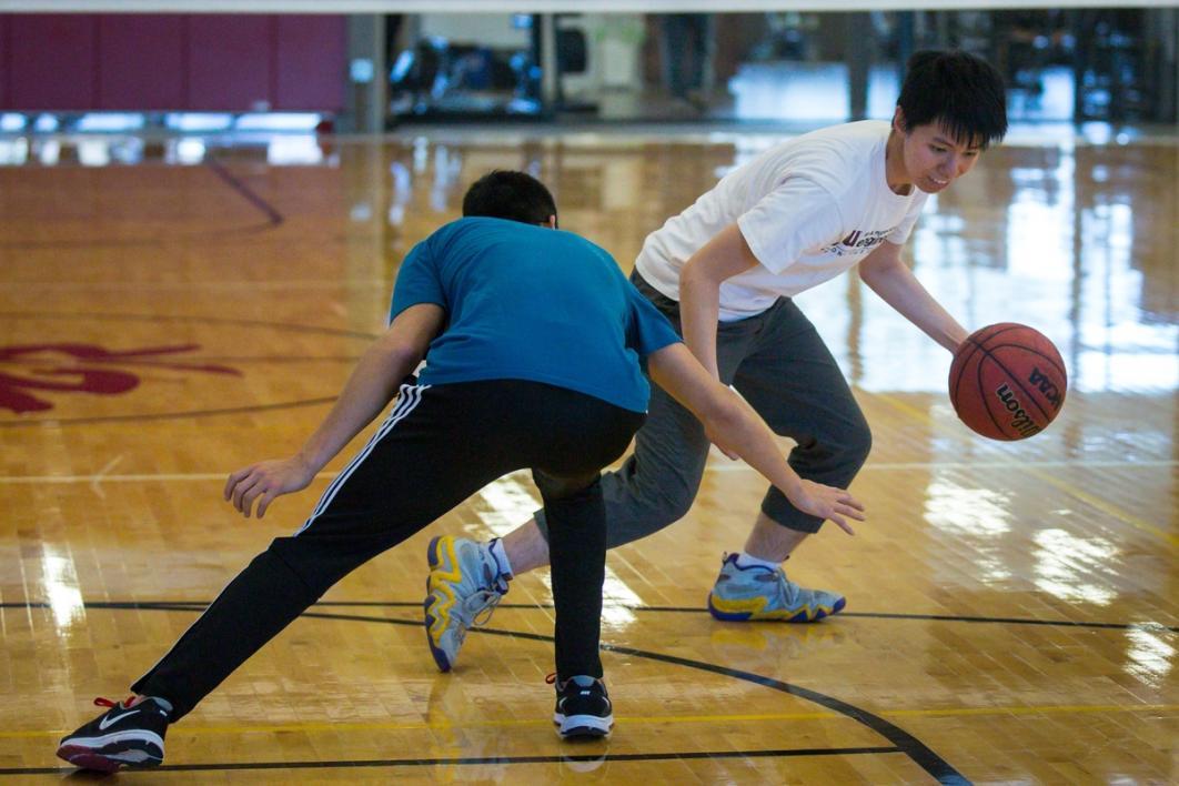 Men playing basketball.