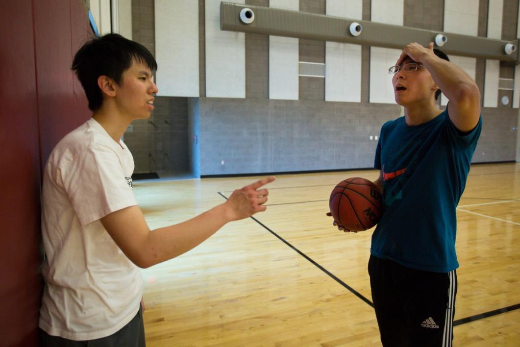 Men playing basketball.