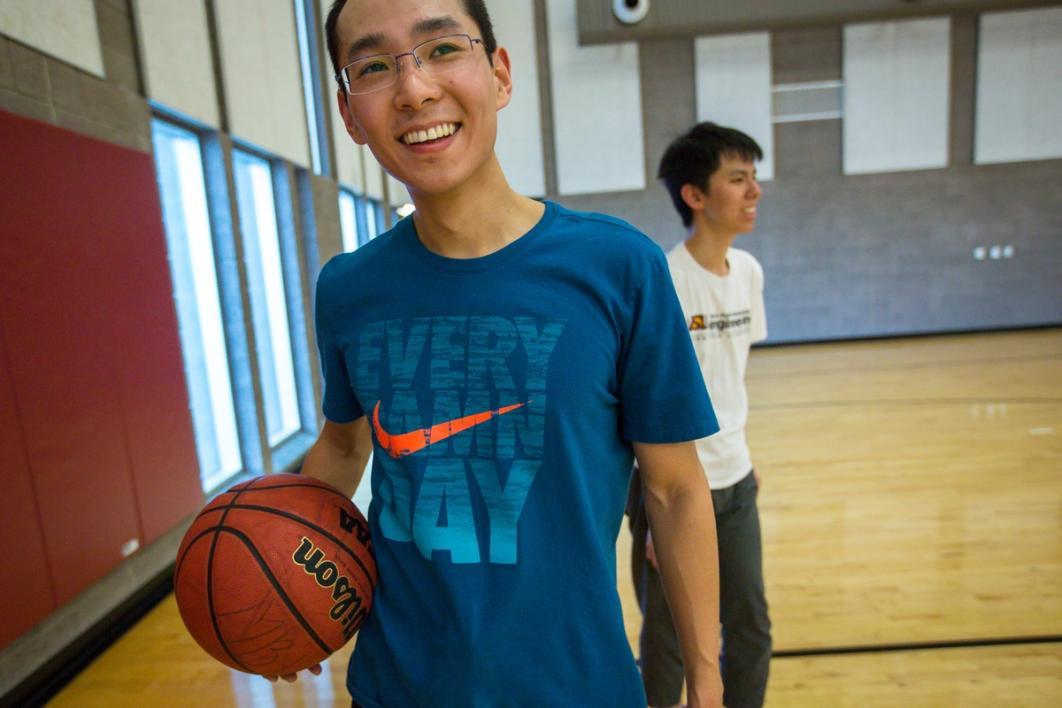 Men playing basketball.