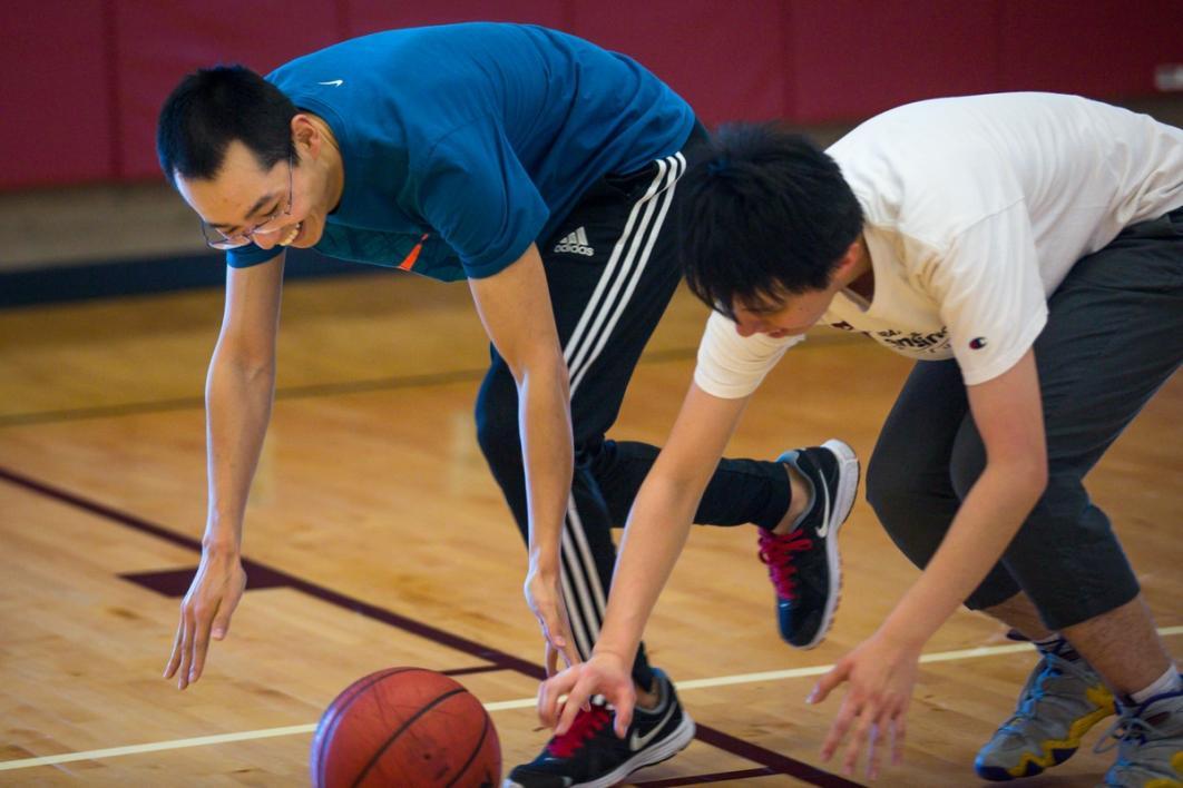 Men playing basketball.