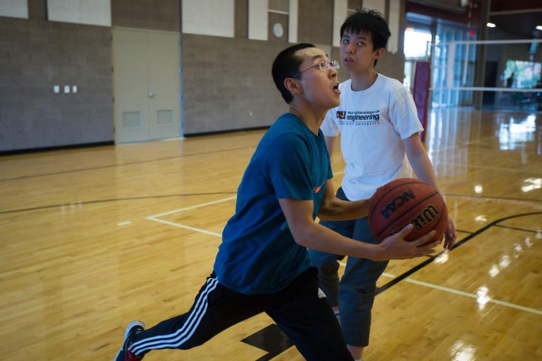 Men playing basketball.