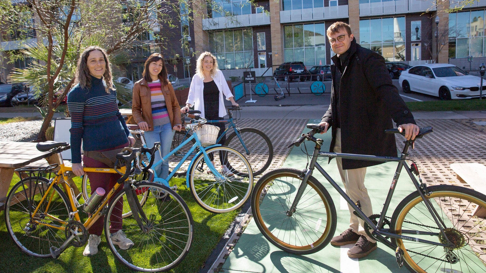 ASU faculty members Thomas Czerniawski, Deborah Salon, Huê-Tâm Jamme and graduate student Hayley Wiers pose with their bicycles in Tempe.