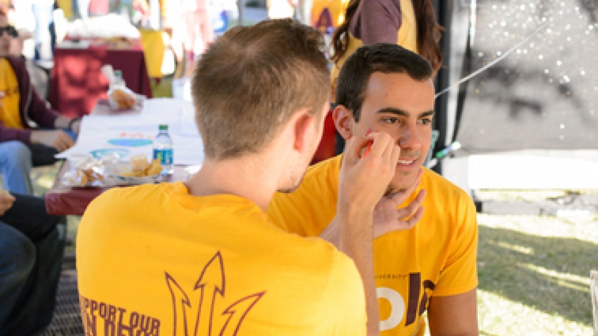 ASU students get their faces painted for Game Day