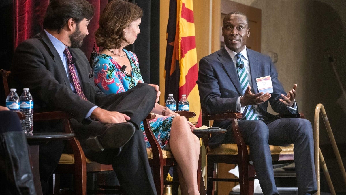 Speakers onstage at the State of Our State conference