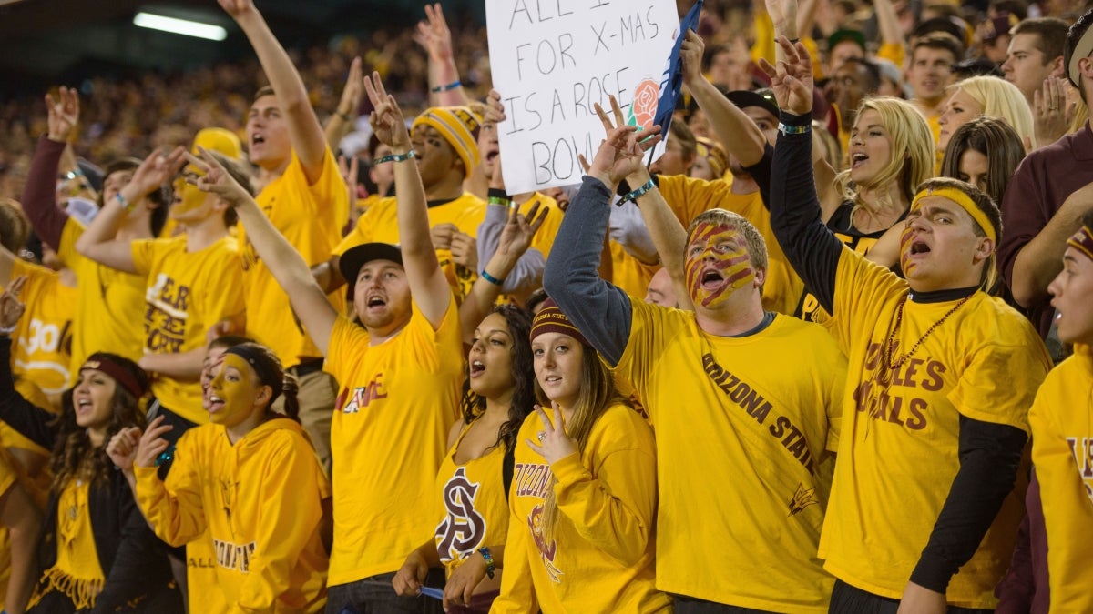 students cheering at football game