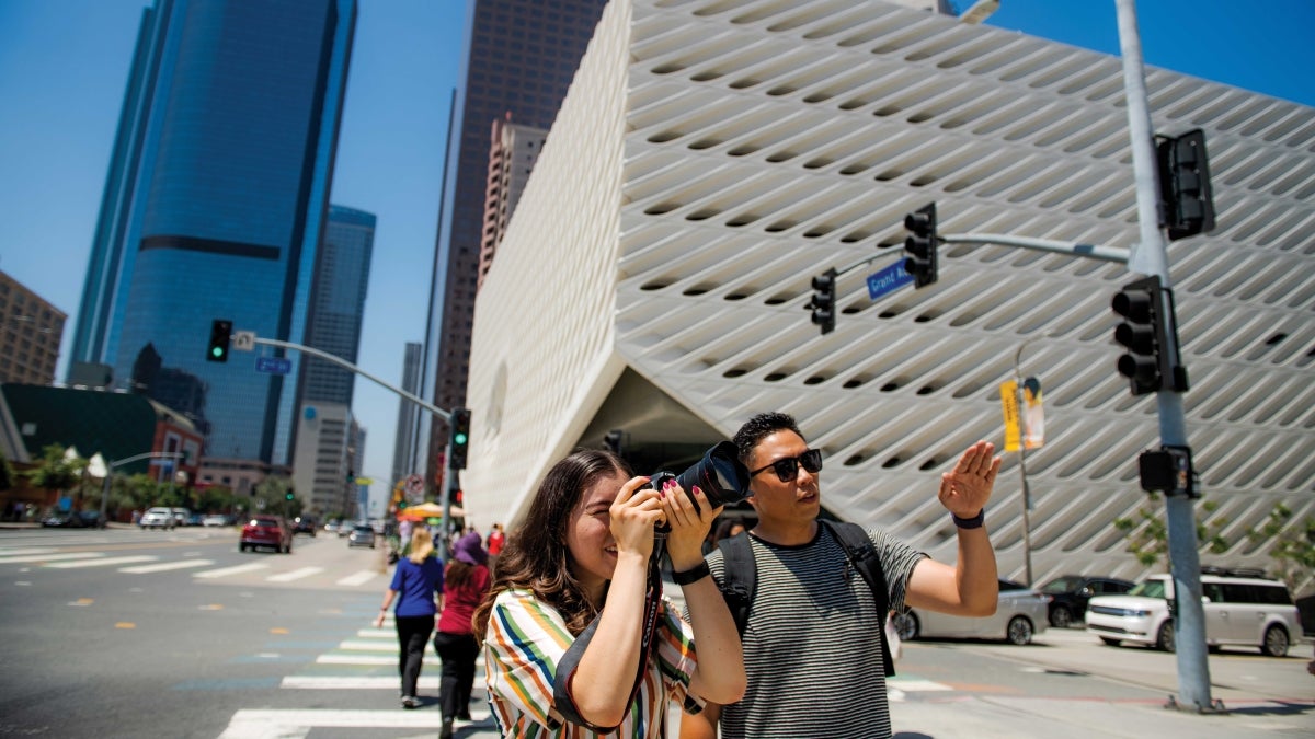 Alisa Murphy take a photo on the streets of Los Angeles