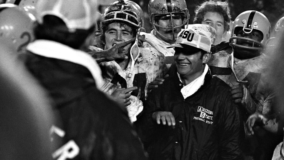 ASU Coach Frank Kush and football players