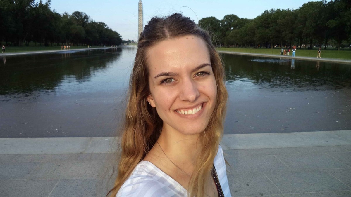 Alexis in front of the National Monument while studying in Washington, D.C.