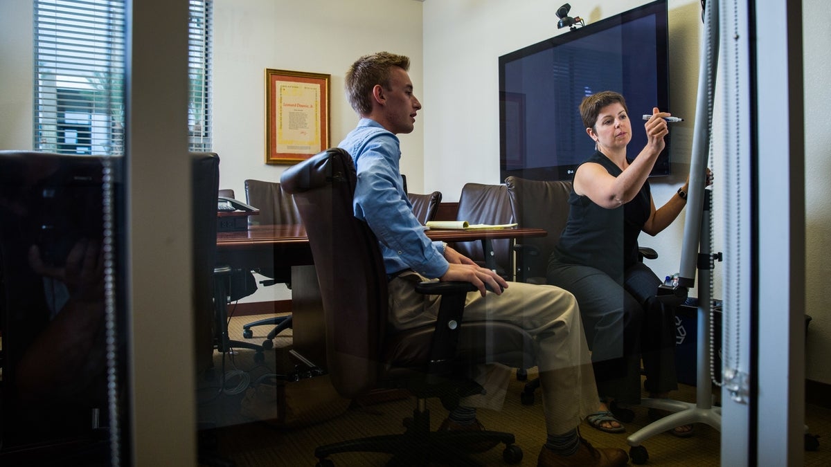 Man and woman in conference room