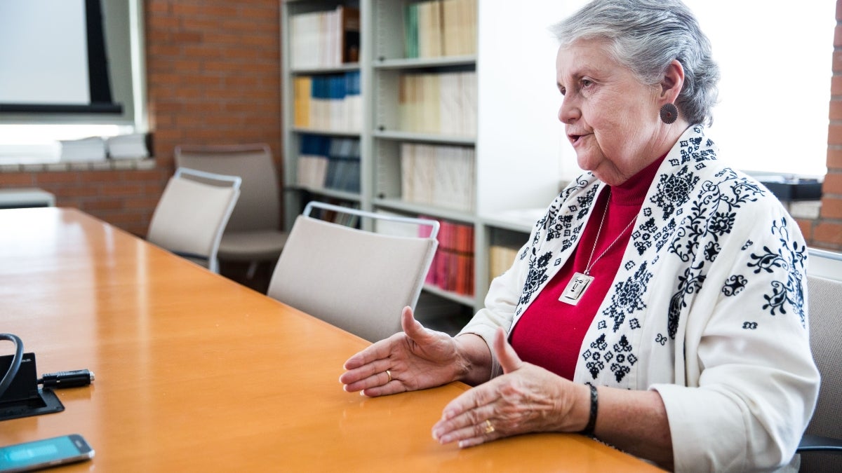 ASU Regents&#039; Professor Jane Buikstra speaks while seated in a conference room.