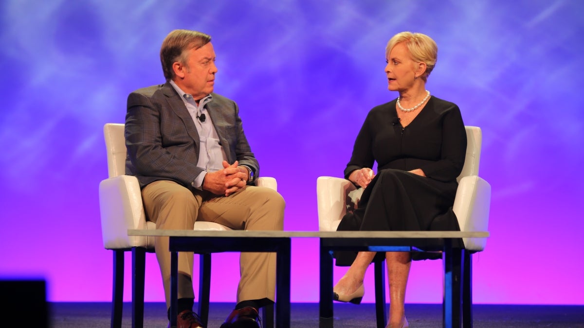 ASU President Michael Crow and Cindy McCain speak onstage