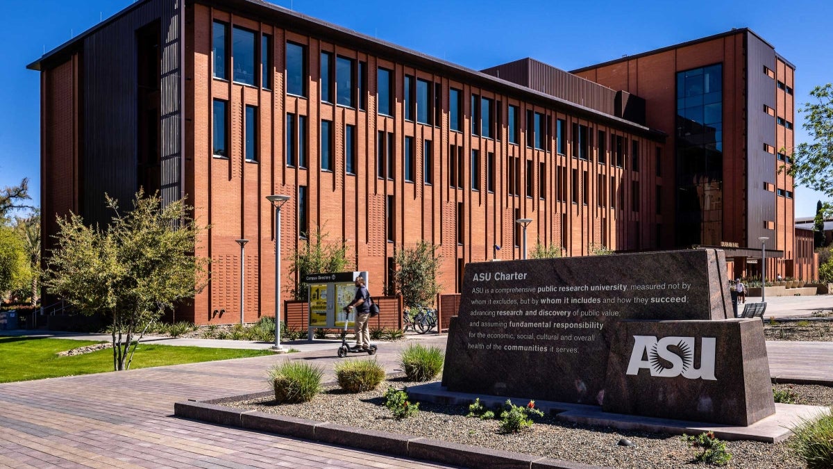 Exterior view of Durham Hall on the Tempe campus with the ASU Charter sign in the foreground.