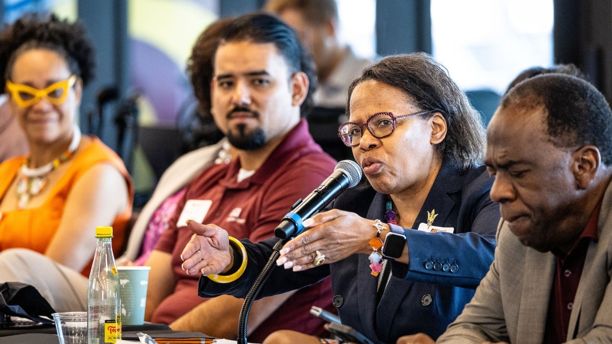 Woman speaking into a microphone during the LIFT Summit.