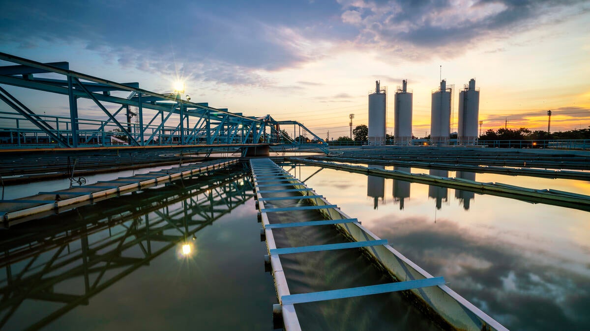 Water treatment plant with sunset in background