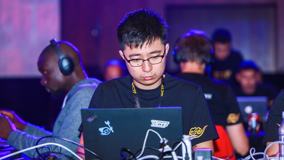 ASU student Kyle Zeng working on a laptop.