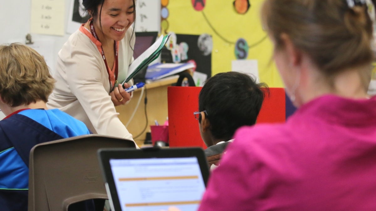 teacher and students in a classroom