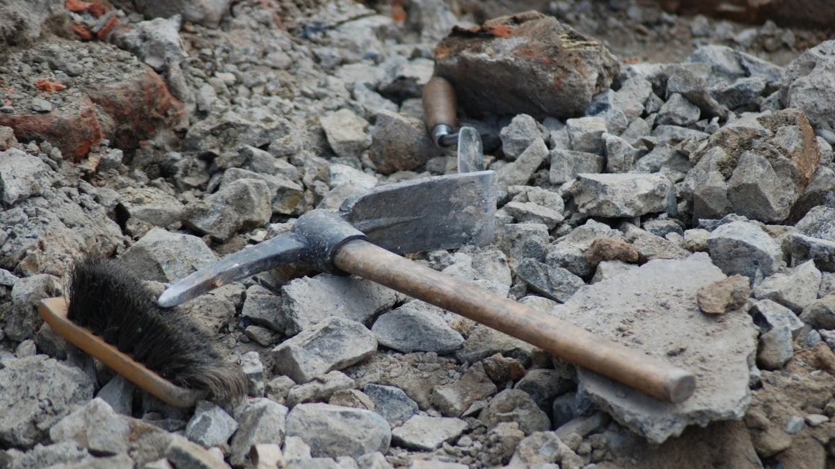 photo of archaeology tools (pick and brush)