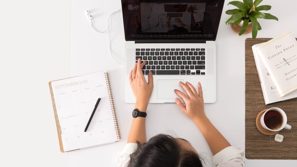 Stock photo, laptop computer, notepad, pens, coffee, student