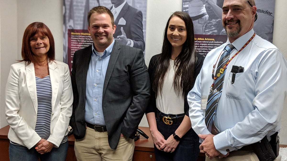 Alumni award winners stand beside CCJ director Cassia Spohn