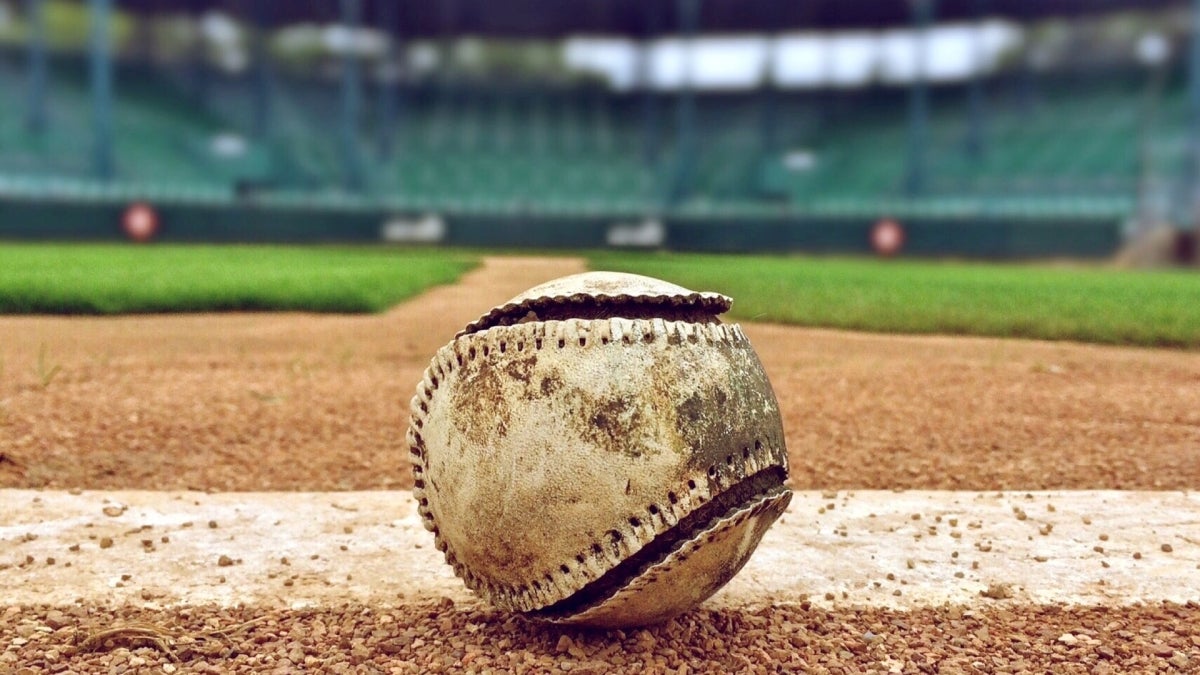 empty baseball field and busted baseball