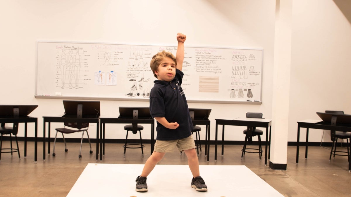 Phoenix Children's Hospital Patient Brendan poses for his Power Play super hero fitting