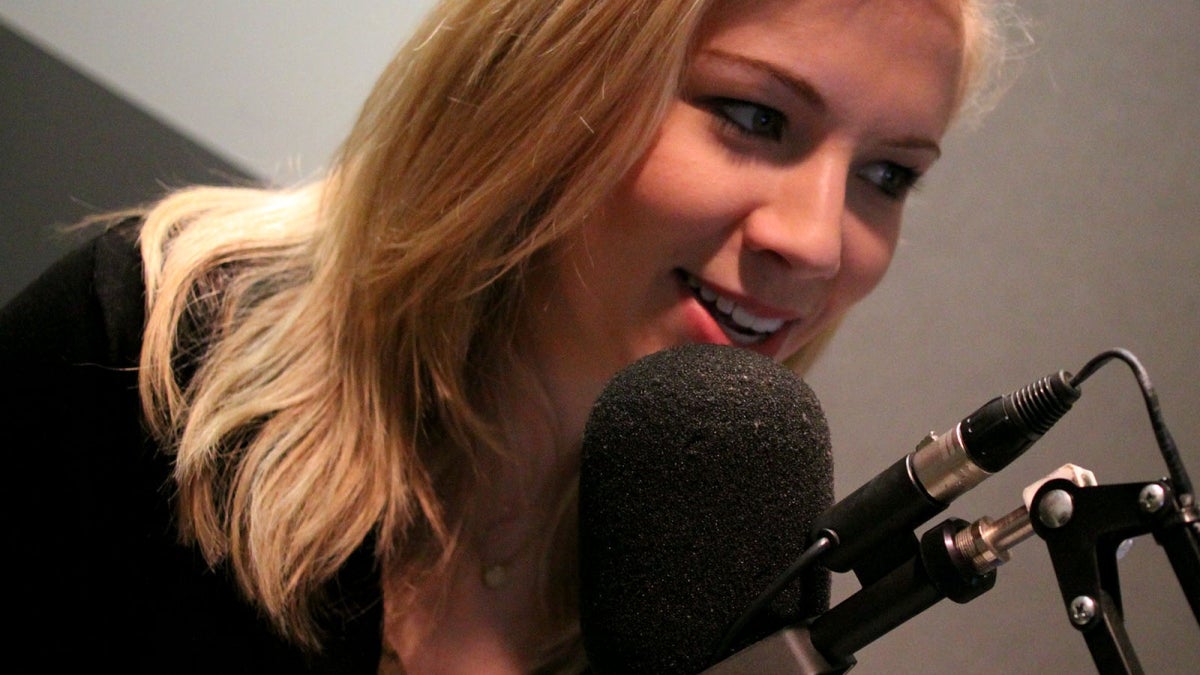 woman speaking into microphone