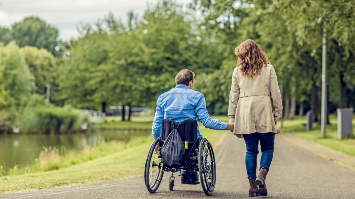 Two people holding hands