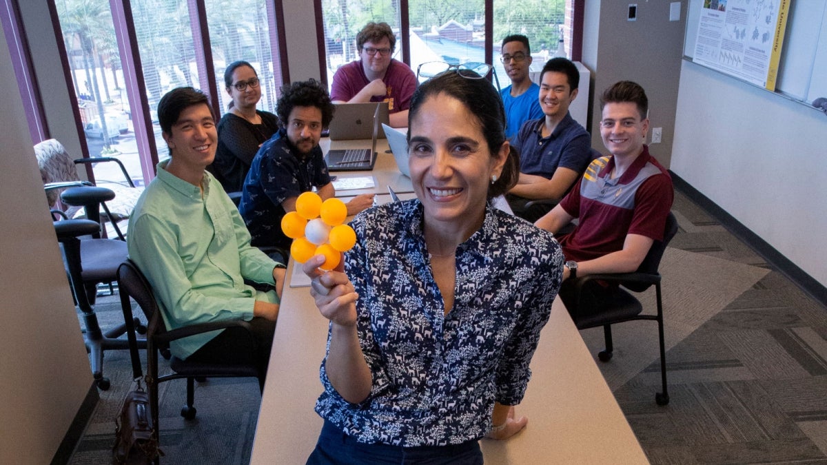 Andrea Richa heads a room of her student researchers. 