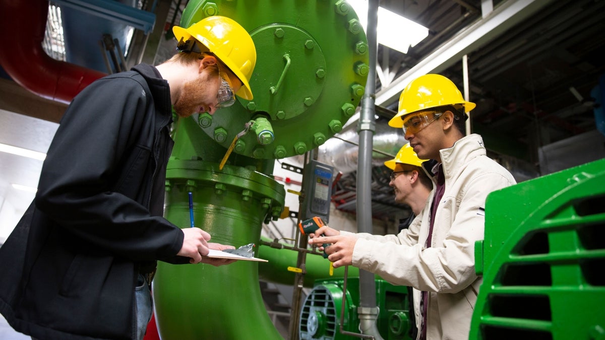 two people in mechanical plant