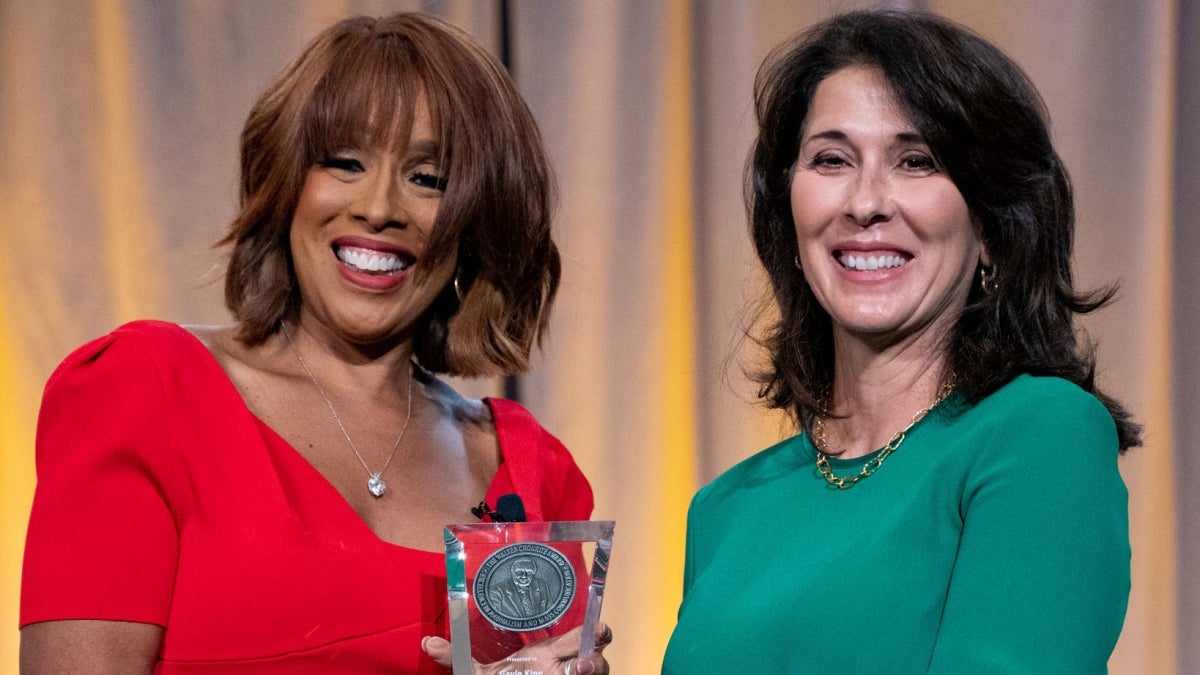 Gayle King accepting an award from ASU Provost Nancy Gonzales.