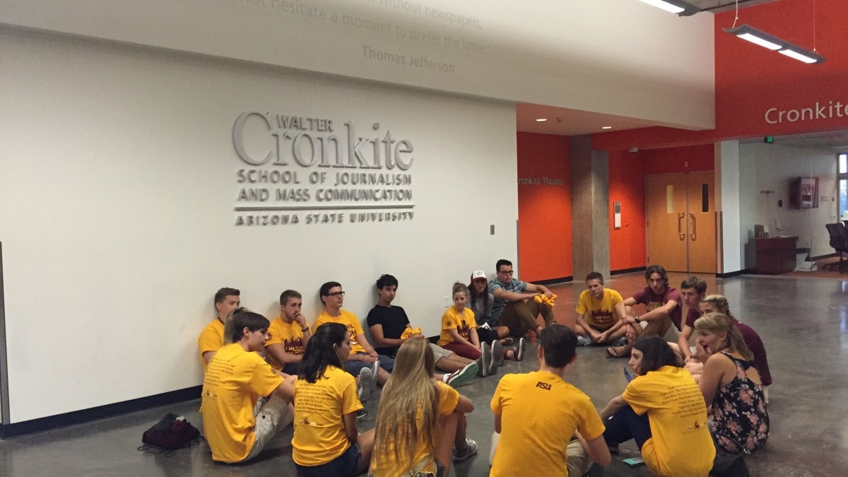 students sitting on floor in a circle