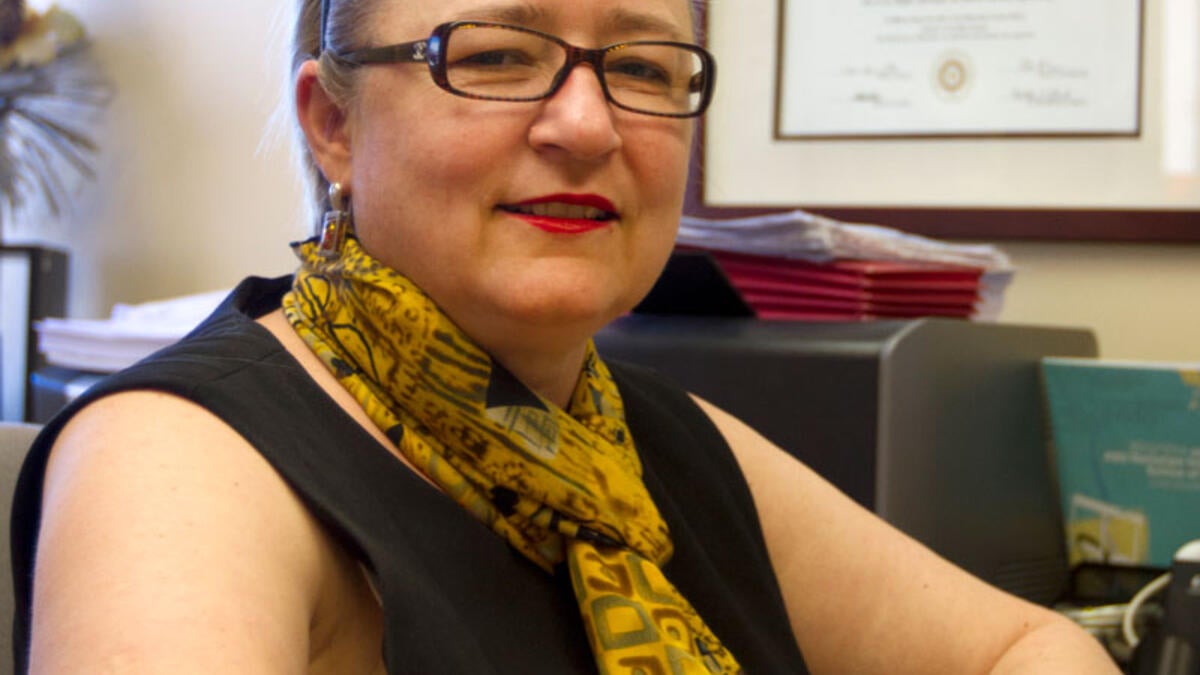 woman sitting at a desk in her office