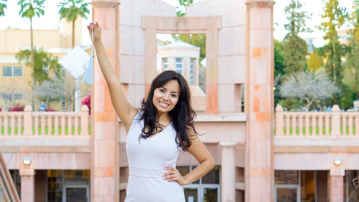 woman holding arm up in the air