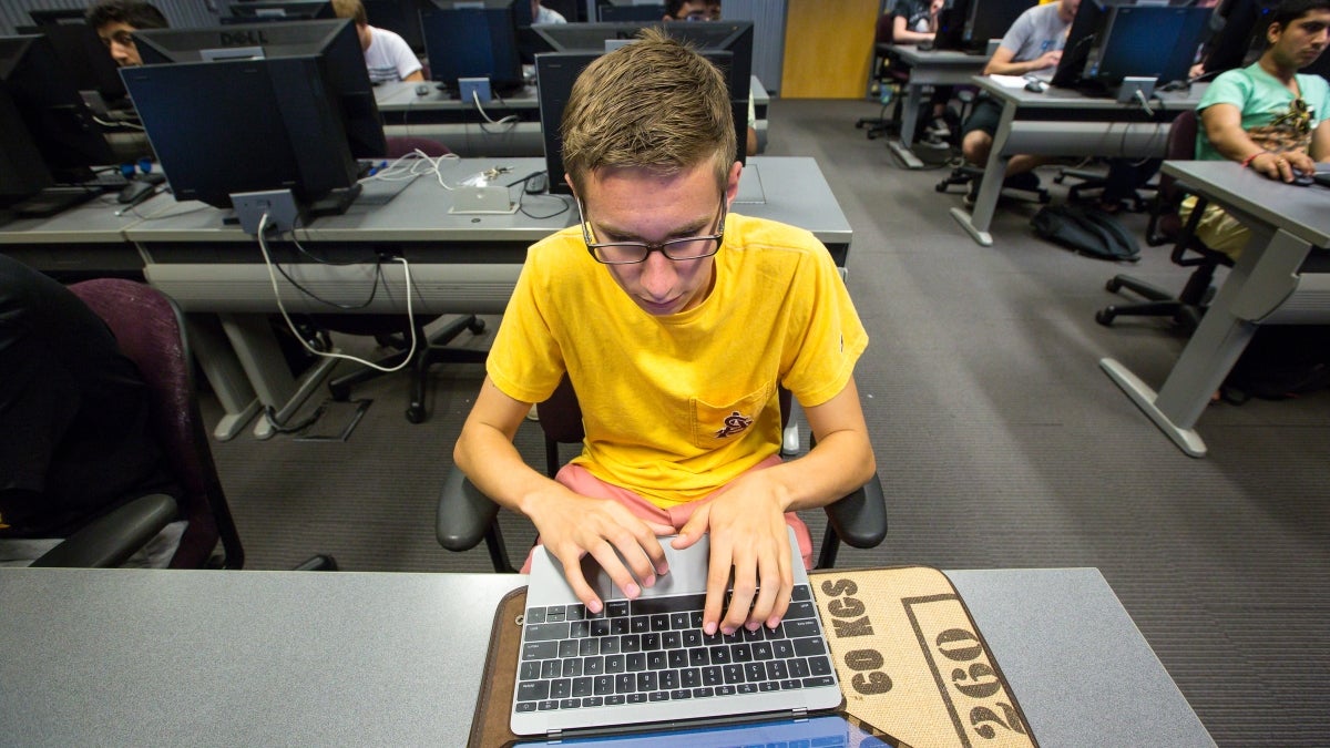 Eric working in a computer lab