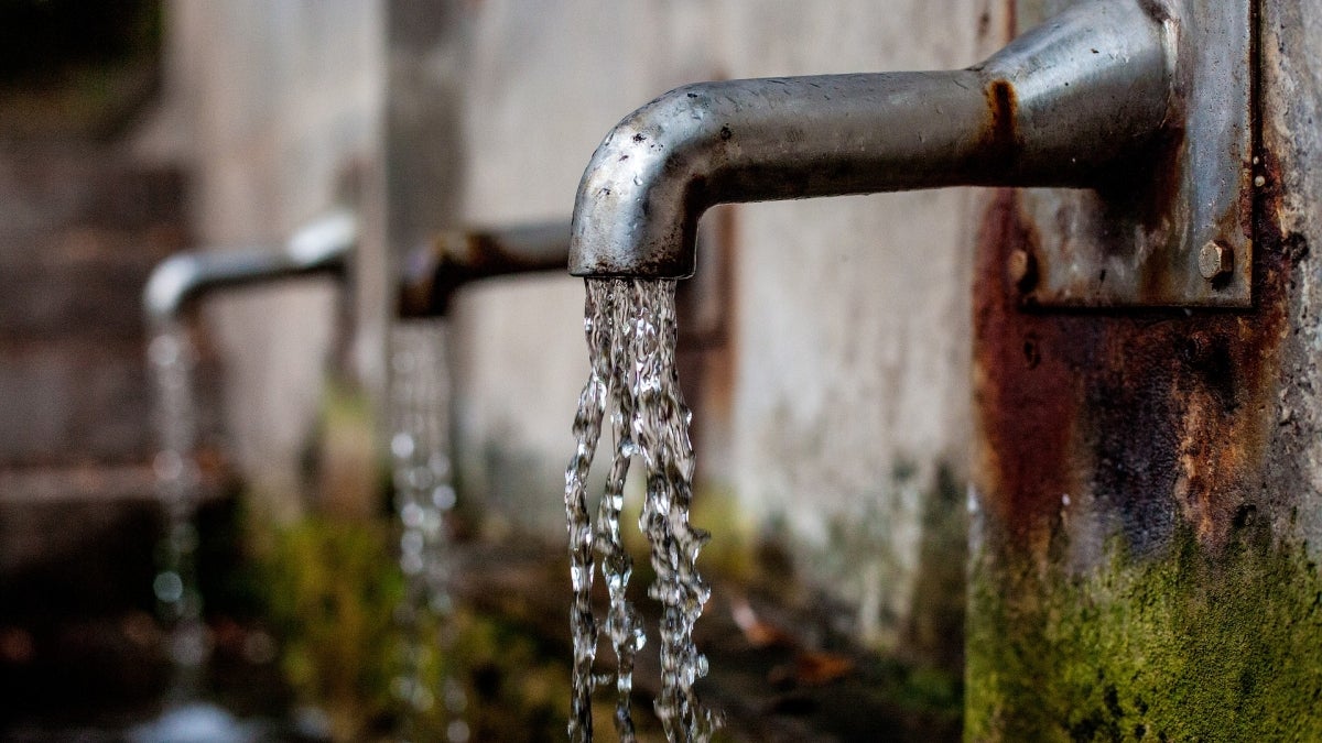 A rusty water fountain or faucet