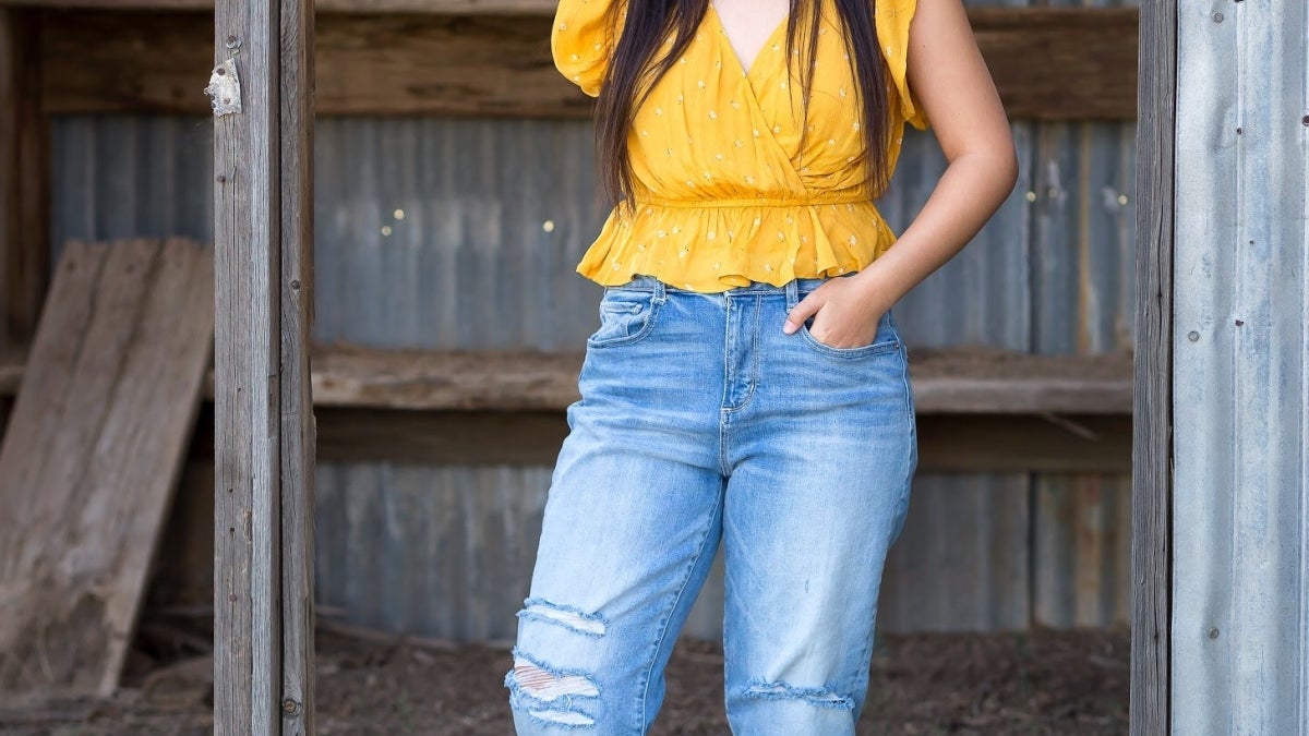 Female standing in a barn