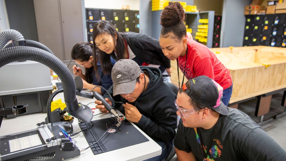 Students work on their robot for the ASU Robo Hackathon