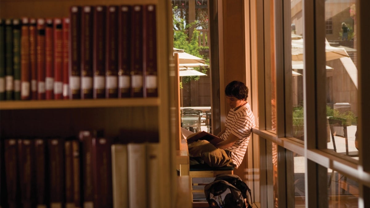 student reading in library