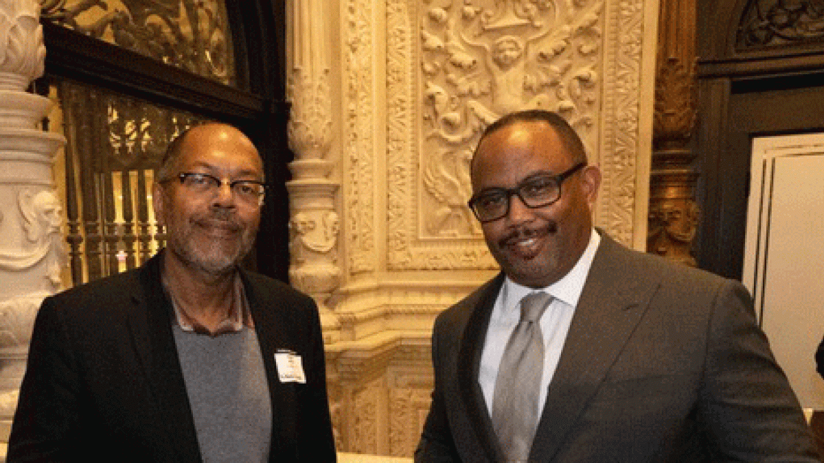 Los Angeles Times Executive Editor Kevin Merida and Battinto Batts, dean of the Walter Cronkite School for Journalism and Mass Communication at ASU, pose side-by-side at an event in an ornately designed lobby.