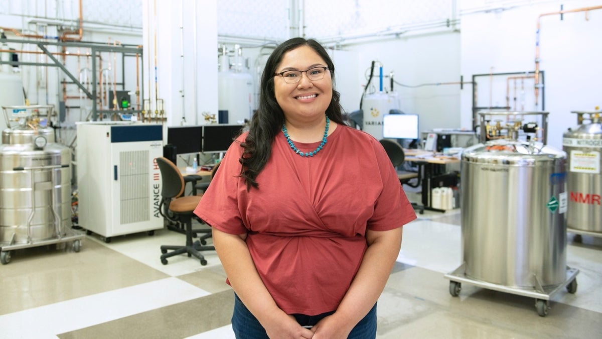 ASU student Shundene Key smiles for a portrait in a lab.