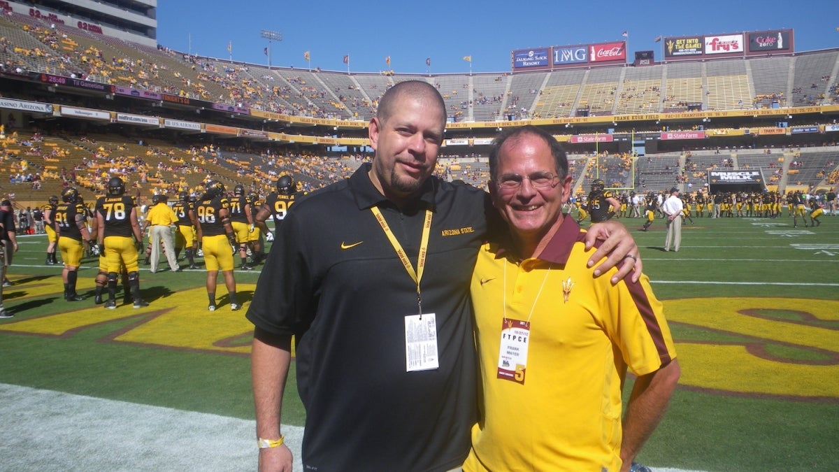 Jean Boyd, Deputy Athletic Director of ASU Athletics and Frank Mayer at Sun Devil Stadium in 2012.